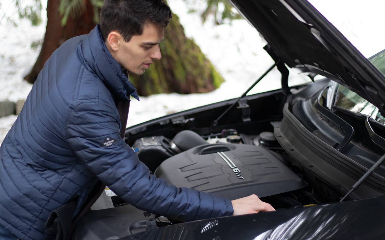 Man Checking Car Engine